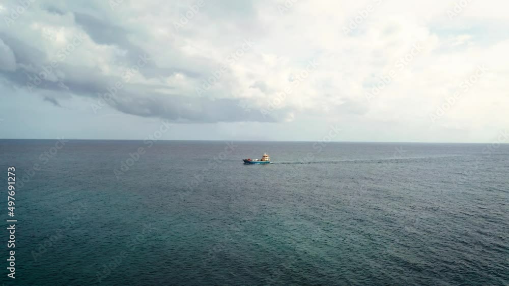 Aerial view of a ferry sailing the Indian Ocean Aerial view of a ferry sailing the Indian Ocean