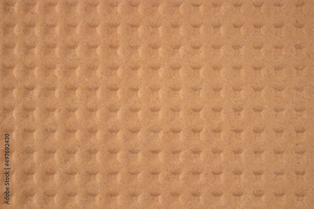 Embossed brown kraft paper as background with copy space. Sustainable packaging concept Embossed brown kraft paper as background with copy space. Sustainable packaging concept
