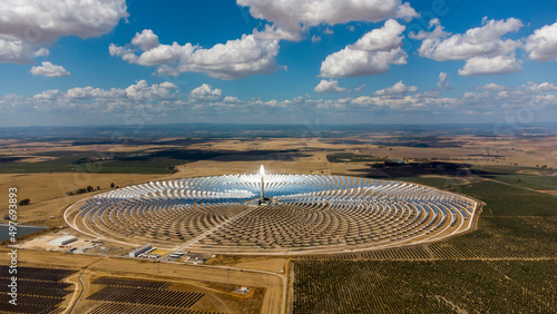 Aerial drone view of Gemasolar Thermosolar Plant in Seville, Spain. Solar energy. Green energy. Alternatives to fossil fuel. Environmentally friendly. Concentrated solar power plant. Renewable energy.