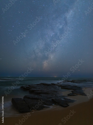 Milky way galaxy over the rocky coastline. © AlexandraDaryl