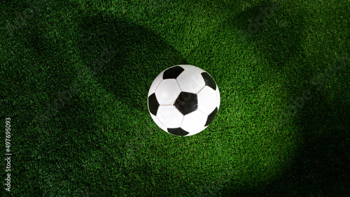 Soccer ball placed on grass  top shot.