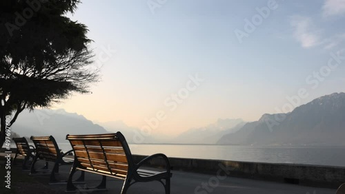 Benches and road on lake Geneva shore with Alps (ID: 497697680)