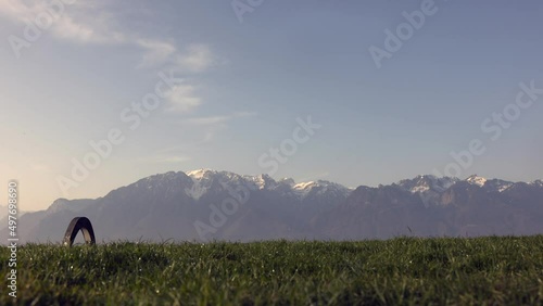 green meadow field and Alps mountains at sunrise (ID: 497698690)