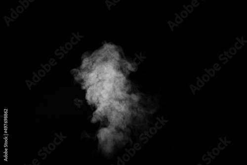 Curly white steam rising up and splashing water scattering in different directions isolated on a black background. Evaporation of liquid and condensation. Can be used as background, design element © Alena