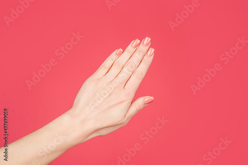 female hand with manicure and smooth skin