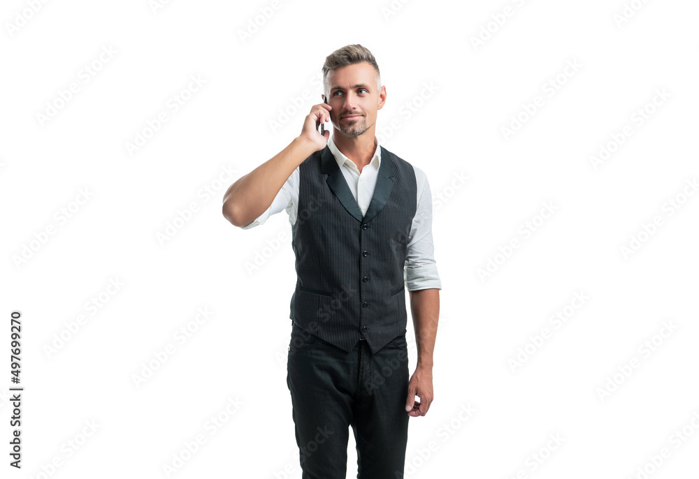 Manager in semi-formal suit vest talking on mobile phone isolated on white Manager in semi-formal suit vest talking on mobile phone isolated on white