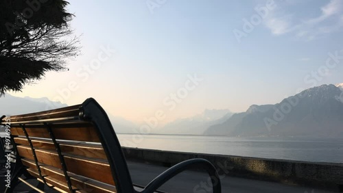 Lake Geneva shore with benches and path in Alps (ID: 497699251)