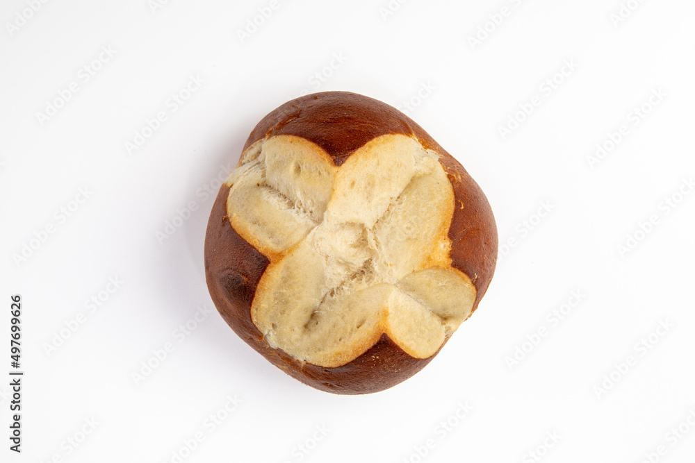 Top View of a Single Pretzel Roll on a White Table