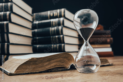 hourglass with book
