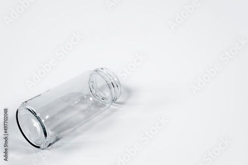 Closeup shot of an empty glass jar isolated on a white background