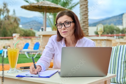 Portrait of business confident middle aged woman looking at camera