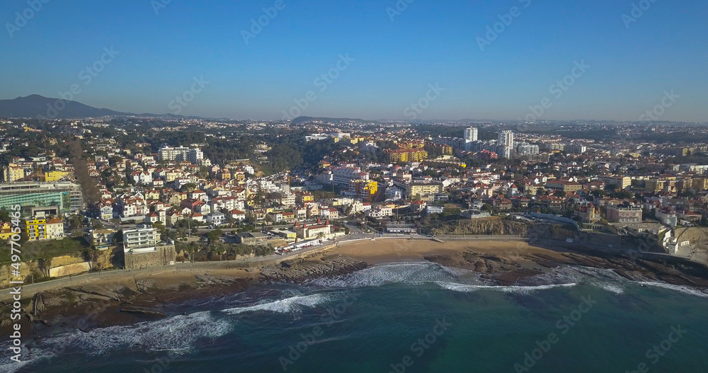 small beach at Estoril with some waves viewed from sky