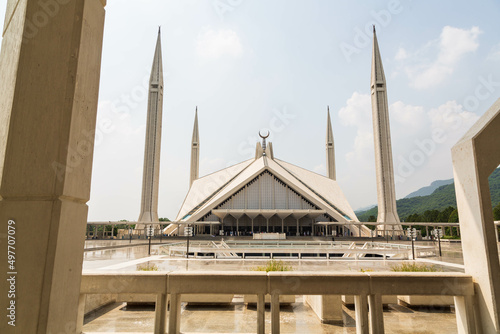 Islamabad, Pakistan - September 2021: Visit to the beautiful Shah Faisal Mosque in Islamabad, Pakistan during a sunny day and cloudy sky. photo