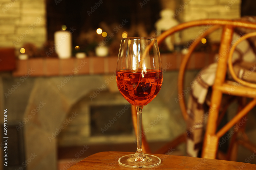 Composition with glass of wine in cozy winter evening