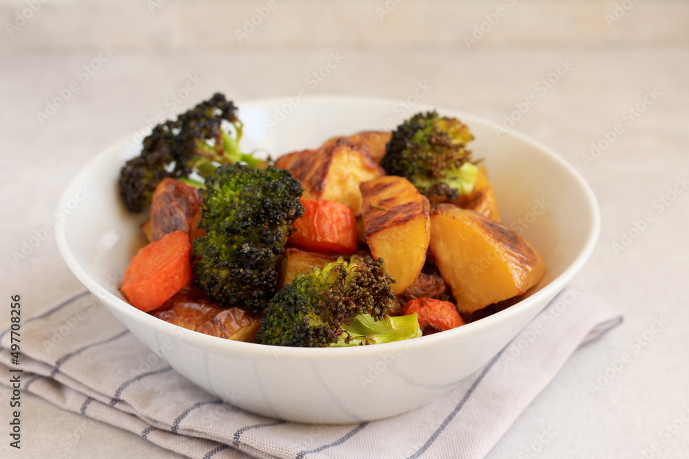Roast vegetables: potato, carrot, broccoli in a bowl Roast vegetables: potato, carrot, broccoli in a bowl