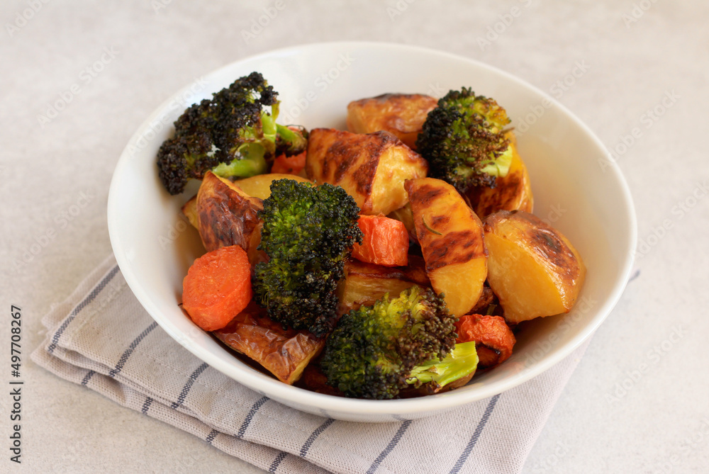 Roast vegetables: potato, carrot, broccoli in a bowl Roast vegetables: potato, carrot, broccoli in a bowl
