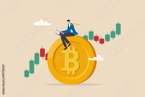 Bitcoin and cryptocurrency investing, crypto trading make profit and earning from Bitcoin price, businessman investor using computer to trade crypto on big Bitcoin with candlestick price graph chart.