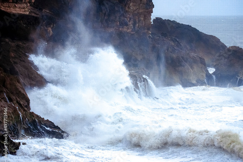 Fototapeta Naklejka Na Ścianę i Meble -  Big waves crashing on the rocks during a storm