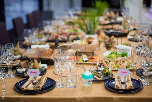 Decorated catering banquet table with different food appetizers assortment on a party