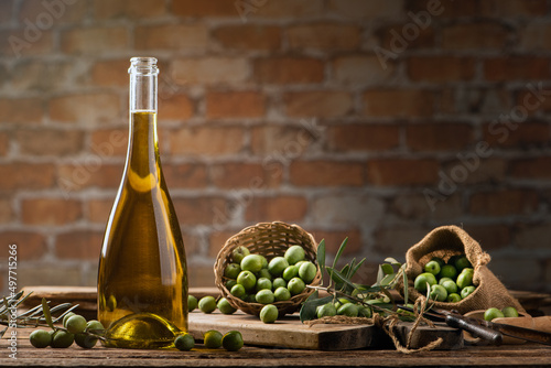 Olives and olive oil in a bottles