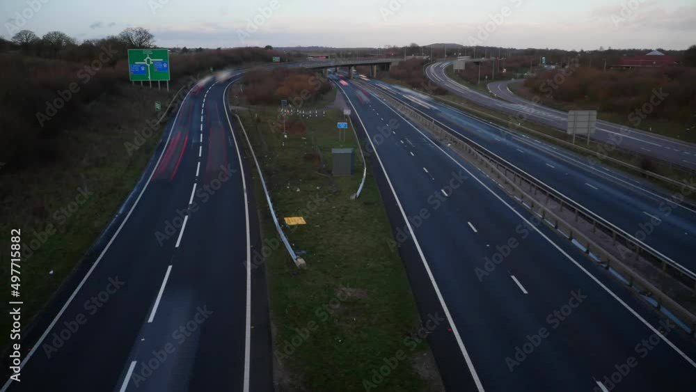 Busy time lapse 'ghost' traffic at a busy motorway intersection Busy time lapse 'ghost' traffic at a busy motorway intersection