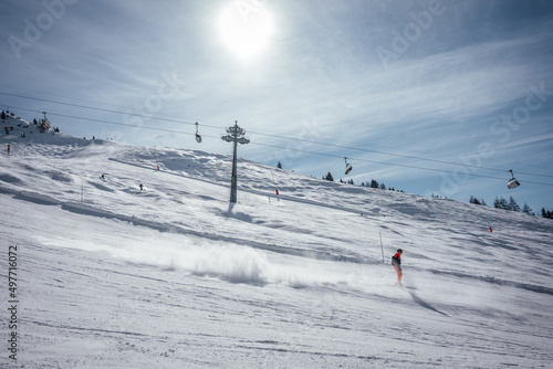 skier on the slope in the sun