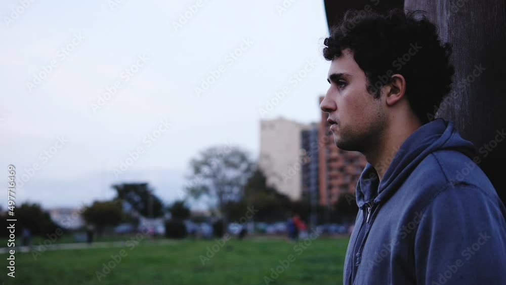 distant couple - young sad couple back to back without communicating distant couple - young sad couple back to back without communicating