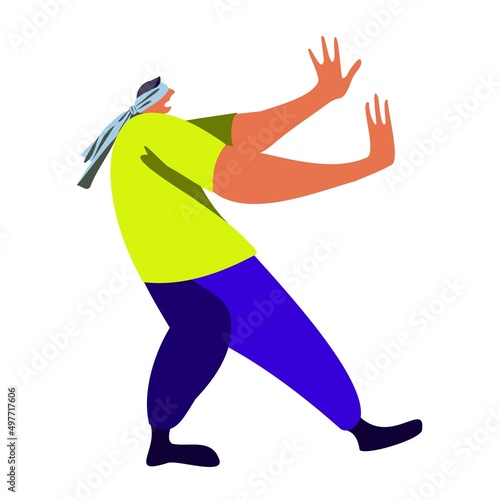 A blindfolded man tries to find his way by touch