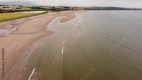 Drone view of the sandy shore during the low tide of the North Sea. photo