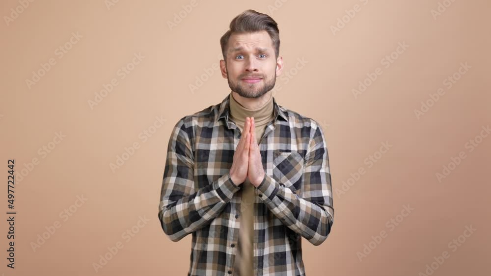 Guy pray hands wait appeal success isolated pastel color background Guy pray hands wait appeal success isolated pastel color background