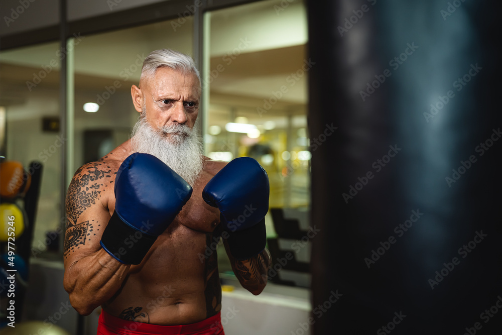 Senior man boxing in sport gym center club - Health fitness and sporty activity concept