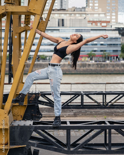 woman dancing on a construction crane