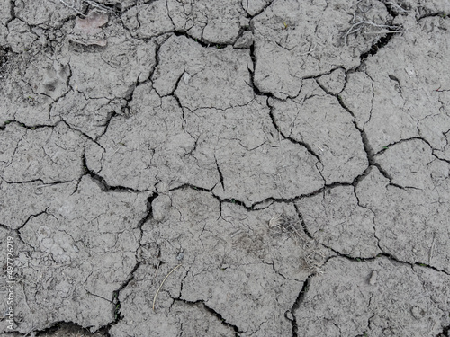 A fragment of the muddy surface of the earth cracked by drought