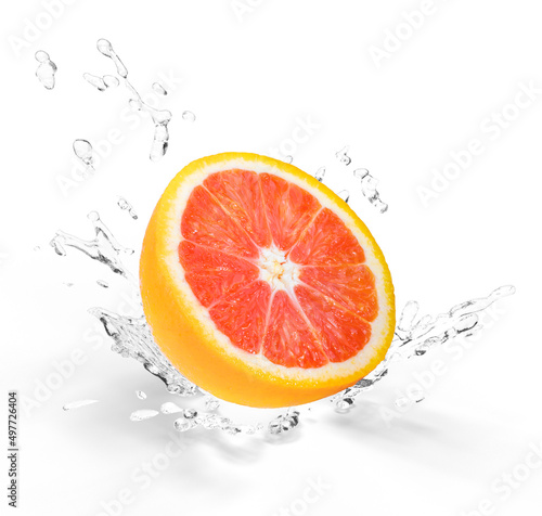 Fresh Orange fruit falling in the air with splash water isolated on white background  Orange fruit on white background With clipping path.