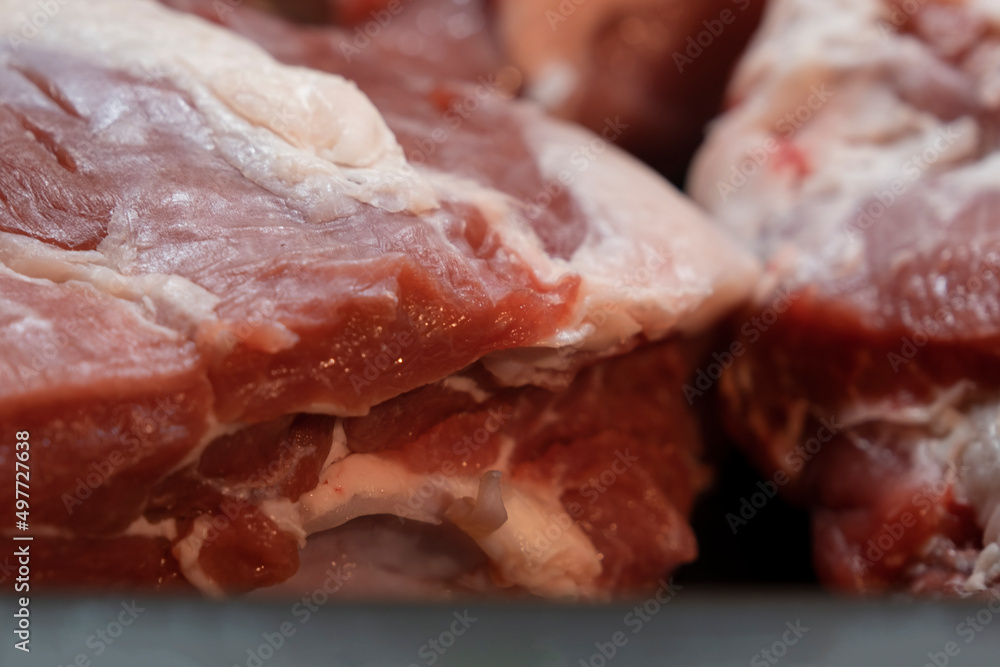 Fresh and raw meat. Whole piece of  steaks in a row ready to cook.  Selective Focus Center
