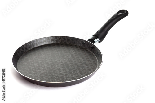 Obraz na plátně new Black pancake pan with non-stick coating on an isolated background