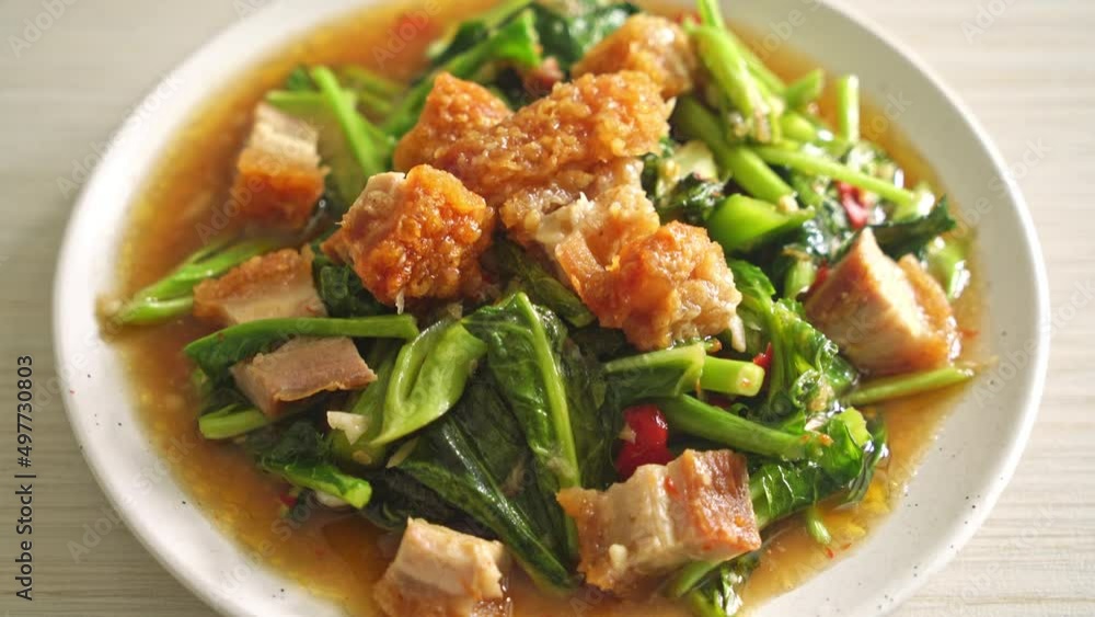 Stir-fried kale vegetable with crispy pork - Asian food style Stir-fried kale vegetable with crispy pork - Asian food style