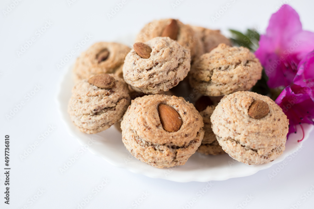 Almendrados, dumplings or typical biscuits made from almonds, sugar and egg white. Almond cakes on white background.