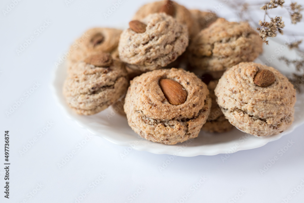 Almendrados, dumplings or typical biscuits made from almonds, sugar and egg whites. Almond cakes on white background.