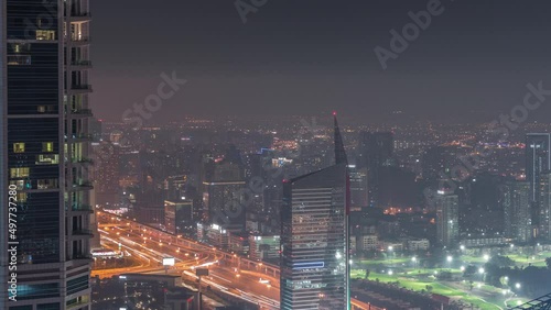 Wallpaper Mural Dubai Aerial view showing al barsha heights and greens district area night timelapse Torontodigital.ca