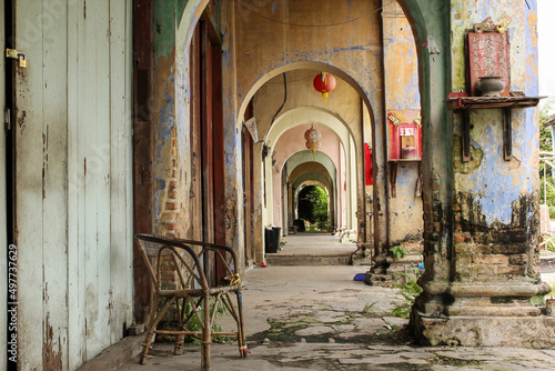 Ruins of a vintage arcade corridor in the abandoned tin mining town of Jalan Papan in the outskirts of the city of Ipoh. photo