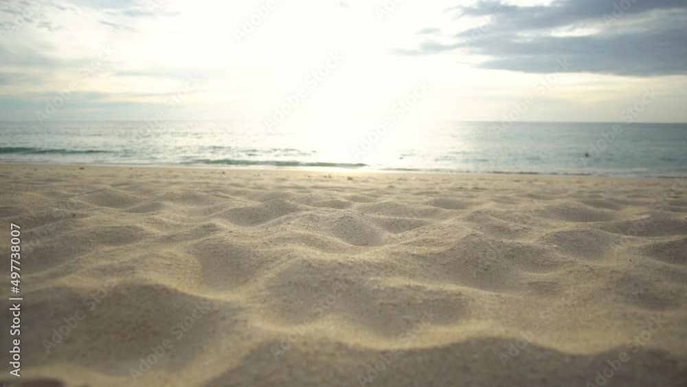 Closeup sand texture dolly shot on beach in sunset on seawater background. At Phuket Thailand. Closeup sand texture dolly shot on beach in sunset on seawater background. At Phuket Thailand.