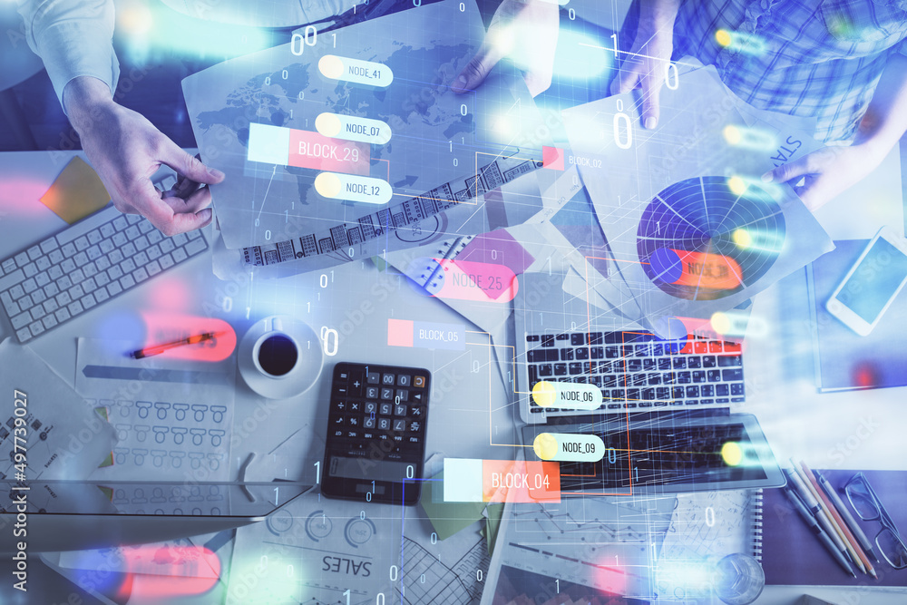 Double exposure of man and woman working together and data theme hologram drawing. Computer background. Top View. Double exposure of man and woman working together and data theme hologram drawing. Computer background. Top View.