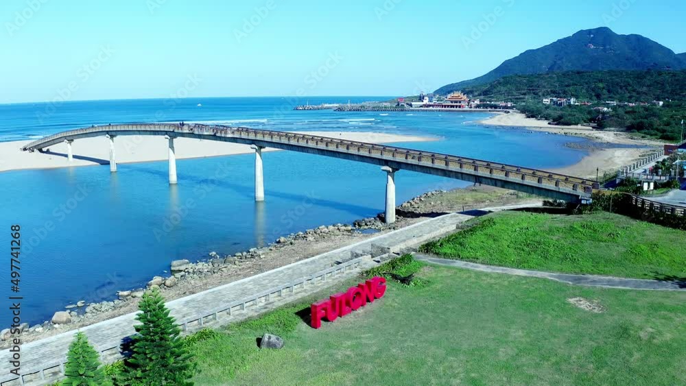 Aerial shot of Fulong Water Bridge with tropical landscape and mountains in background - Taiwan,Asia Aerial shot of Fulong Water Bridge with tropical landscape and mountains in background - Taiwan,Asia