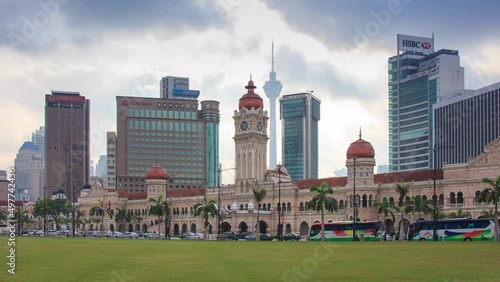 KUALA LUMPUR, MALAYSIA - JULY 27, 2018: Many People Visit Sultan Abdul Samad Building Landmark Historical Place Of Merdeka Square Park. Kuala Lumpur, MALAYSIA photo