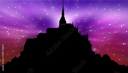  creative image of the famous Mont-Saint-Michel Normandy, France in silhouette with colourful dramatic bokeh skys