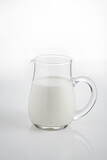 Natural whole milk in a jug  isolated on a white background 