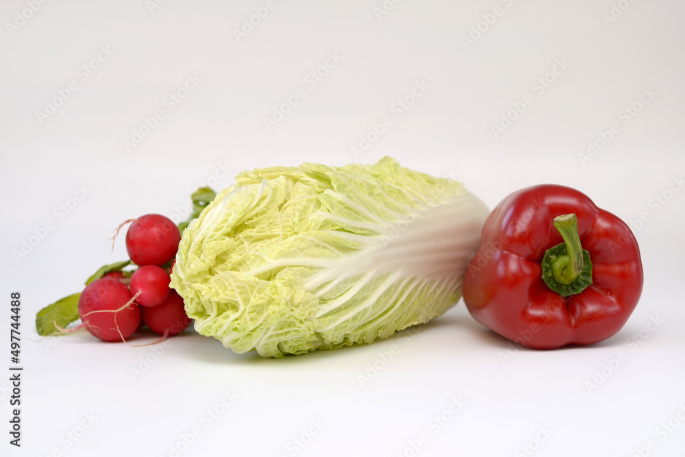 fresh vegetables, Chinese cabbage, paprika and radish on a white background