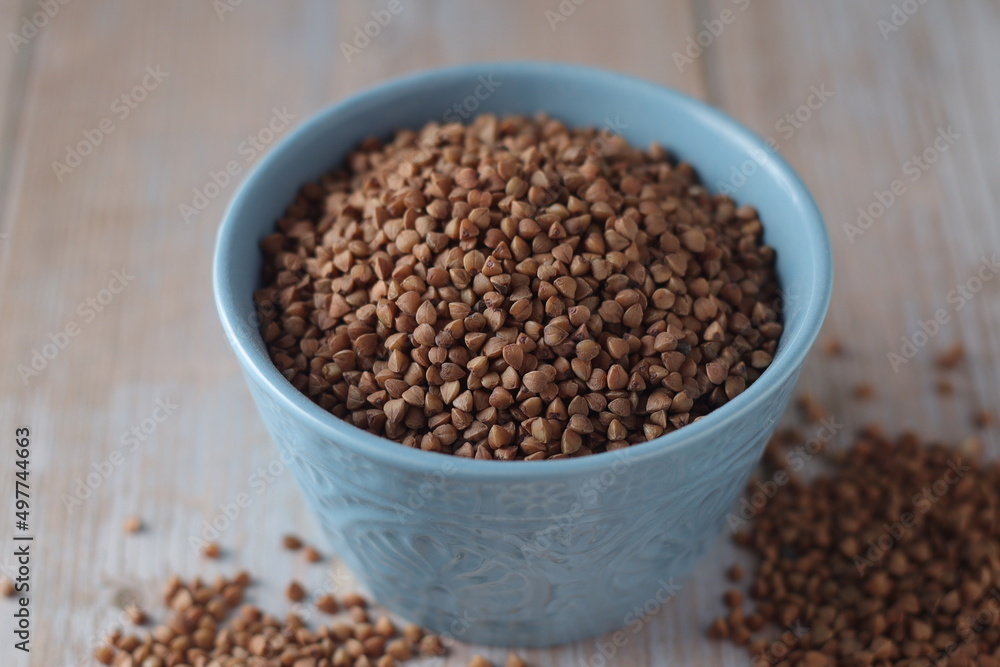 Buckwheat grain in a small ceramic bowl Buckwheat grain in a small ceramic bowl