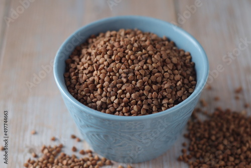 Buckwheat grain in a small ceramic bowl	